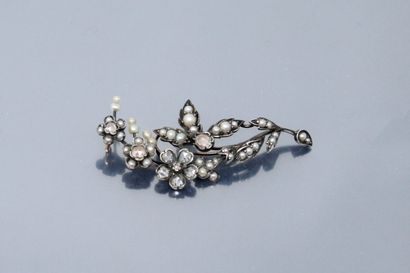 null Silver brooch styling a branch adorned with pink diamonds and pearls. 

Gross...