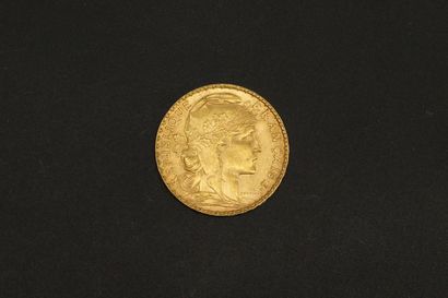 null Pièce en or jaune de 20 Francs au Coq (1907). 

Poids : 6,45 g.