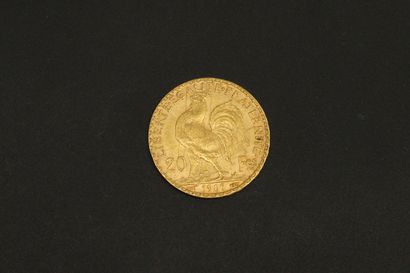 null Pièce en or jaune de 20 Francs au Coq (1907). 

Poids : 6,45 g.