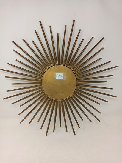 null CHATY sun mirror with flat central glass and gilded radiant metal decoration....