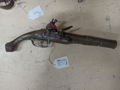 null 1/ Percussion rifle. Composite.

2/ Flintlock pistol. Silver plated and nielloed...