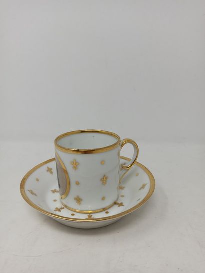null CAEN Porcelain cup and saucer decorated with fleur-de-lis and golden dots. The...