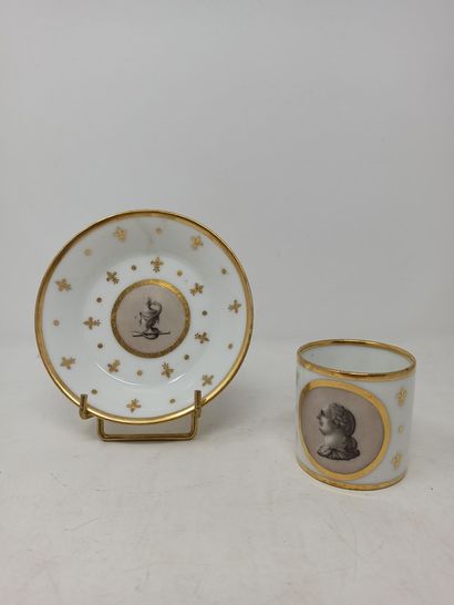 null CAEN Porcelain cup and saucer decorated with fleur-de-lis and golden dots. The...