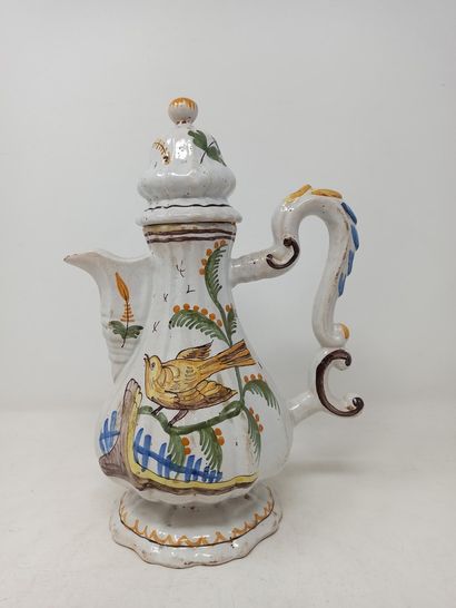 null Earthenware coffee pot with a bird design. 19th century. Lid broken and glued...
