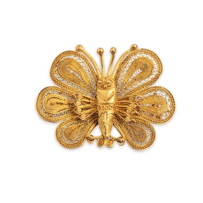 null Butterfly brooch in 18K (750) yellow gold with filigree. 

Owl hallmark.

Dimensions...