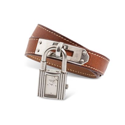 null HERMÈS 

Ladies' wristwatch in steel. Padlock" shaped case on a clasp. Silvered...