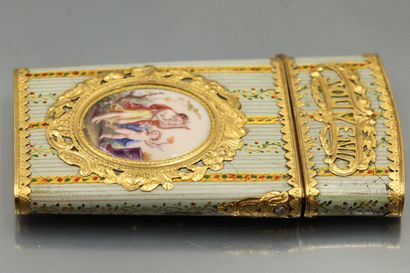 null A gold and polychrome enamel case, trapezoidal in shape, with two sides decorated...
