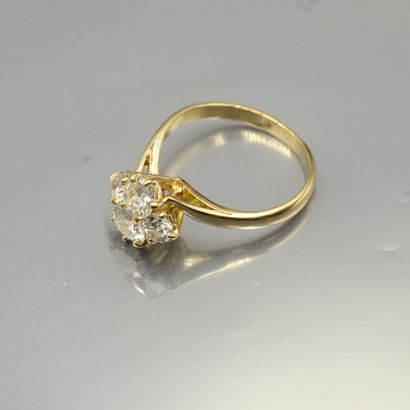 null 18k (750) yellow gold ring set with four diamonds, three old cut and one brilliant...