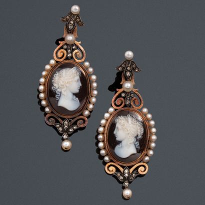 null A pair of 18k (750) gold and silver earrings set with an oval cameo on agate...