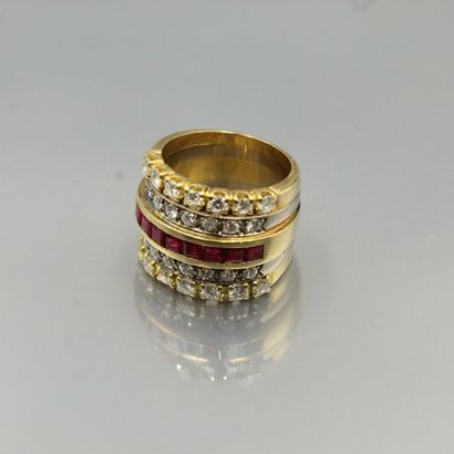 null 18K (750) yellow and white gold band ring set with a line of calibrated red...