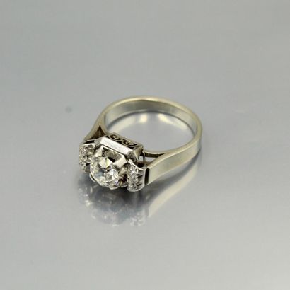 null An 18K (750) white gold and platinum ring set with an old cut diamond and six...