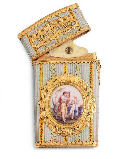 null A gold and polychrome enamel case, trapezoidal in shape, with two sides decorated...