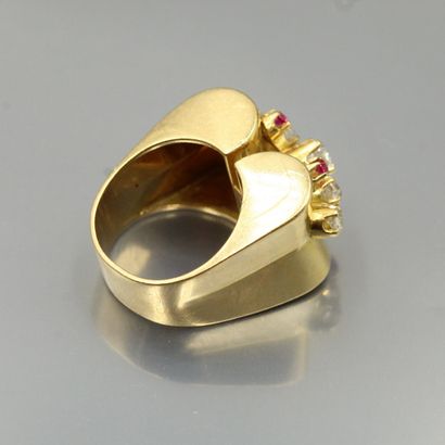 null An 18K (750) yellow gold cocktail ring set with old cut diamonds and red stones.

Weight...
