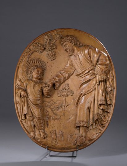 null Oval panel in basswood carved in high relief representing Saint Joseph holding...