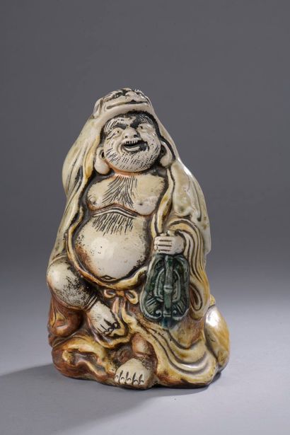null CHINA - Circa 1900

Statuette of Guanyin enamelled turquoise on the biscuit,...