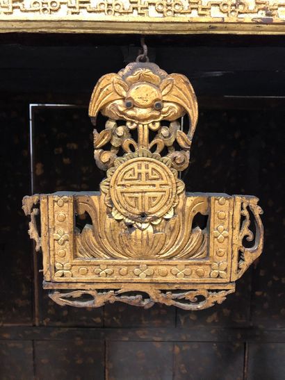 null Buddhist altar in carved wood lacquered in black and gold, opening in the lower...