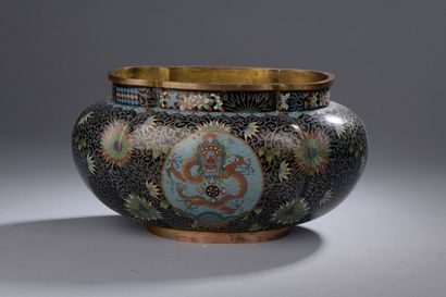 CHINA - 20th century 
A gilt bronze and cloisonné...