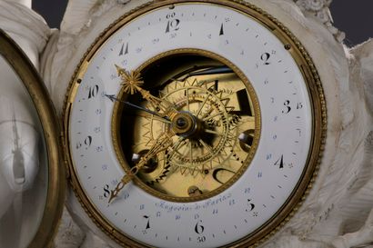 null Bisque clock 

figuring a rock decorated with foliage topped by a basket of...