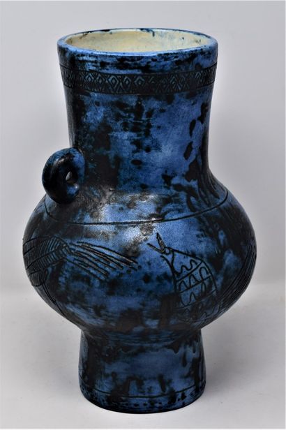 null 
BLIN Jacques (1920-1995)


Blue glazed ceramic pitcher with black patina and...