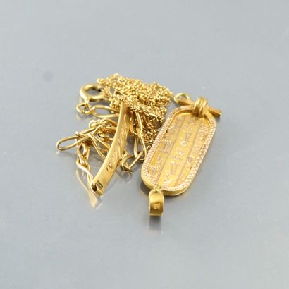 null Lot d'or jaune 18k (750) comprenant une chaine à maille gourmette, un pendentif...