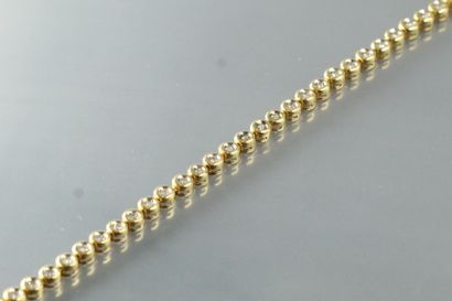 null Bracelet en or jaune 18k (750) à maille ronde, ornée de diamants ronds en sertis...