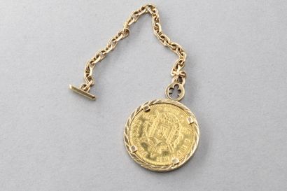 null Gold coin of 20 francs Napoleon III head laurel, mounted in key ring, yellow...