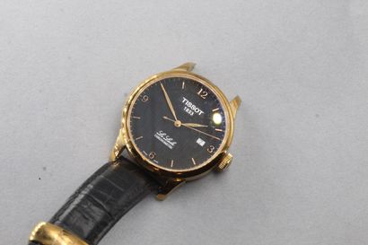 TISSOT 
Men's wristwatch, round case in gilt...