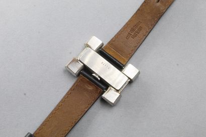 null Men's wrist watch, H-shaped metal case, black dial.

black background.

Dial...