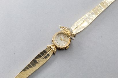  Montre bracelet de dame en or jaune 18k (750), boîtier rond, cadran à 
fond crème,...