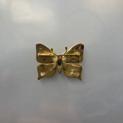 null 18k (750) yellow gold butterfly brooch, the wings adorned with sapphire, ruby...