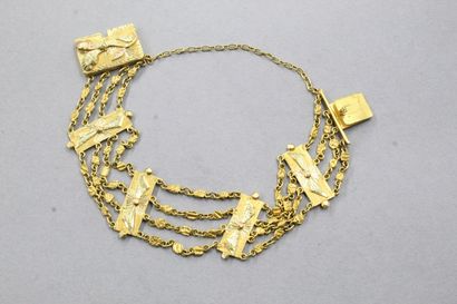 null Bracelet en or jaune et rose 18k (750) formé de quatre rangs alterné de plaque...