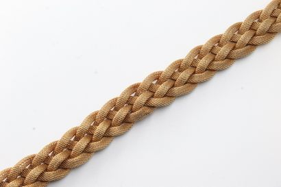 null Bracelet in 18k (750) gold with braided mesh.

Wrist size: 19 cm. - Weight :...