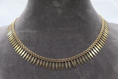 null 18K (750) yellow gold necklace with double rings holding diamond-shaped fringes.

Necklace...