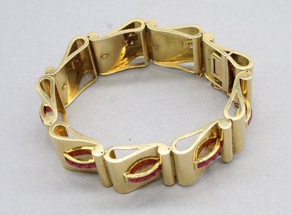 null Bracelet en or jaune 18k (750) orné de rubis synthétiques calibrés. 

Poids...