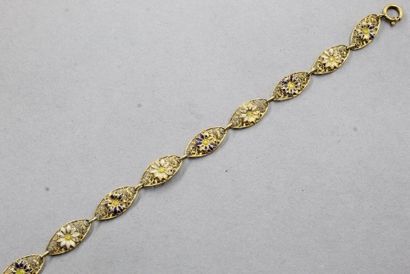null Bracelet filigrané en or jaune 18k (750) à décor de fleurs en émail.

Tour de...