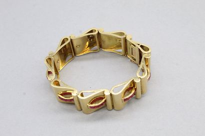 null Bracelet en or jaune 18k (750) orné de rubis synthétiques calibrés. 

Poids...
