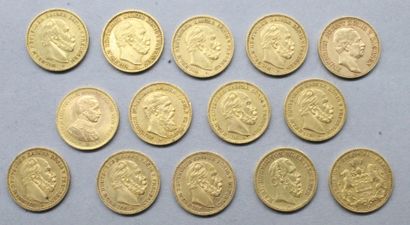 null Lot of fourteen gold coins including :

- 20 Mark Freie und Hansestadt Hamburg...
