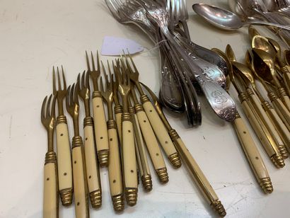 null MANETTE of silver plated metal including:

12 forks, 12 soup spoons, 1 leg of...
