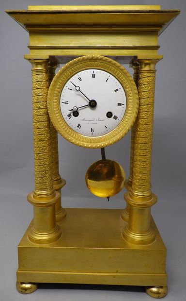 Gilt bronze portico clock with four twisted...