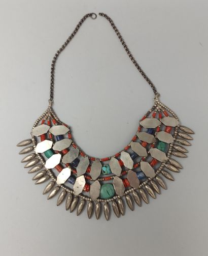 null Two rows of silver motifs alternating with coral, lapis and turquoise cabochons...