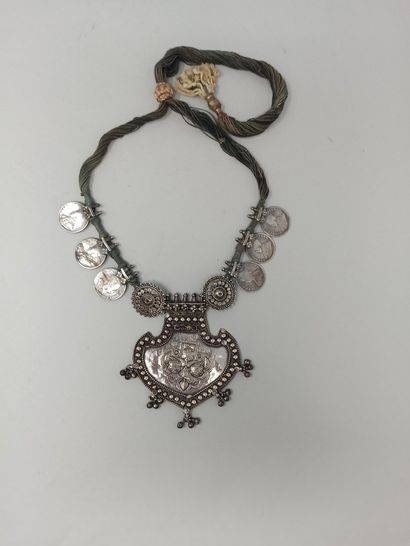 Silver pectoral necklace decorated with stylized...