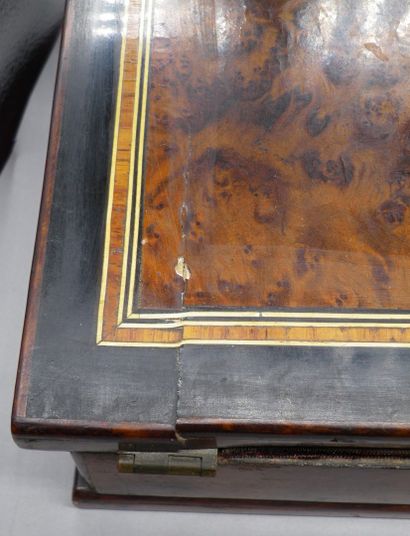 null Veneer writing desk with marquetry and brass fillet decoration.

The front side...