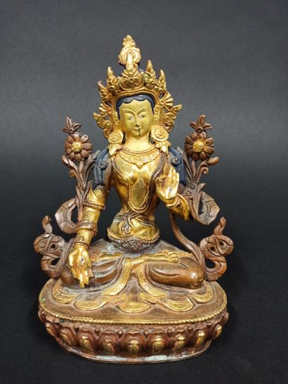 null Buddha in copper alloy represented sitting on a lotiform base making the gesture...