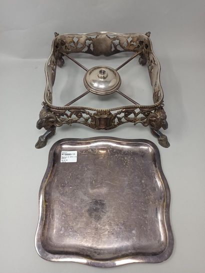 Square-shaped silver-plated metal stove resting...
