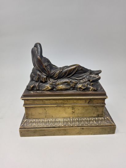 null 
Rectangular inkwell in gilt metal, the lid surmounted by a reclining woman...