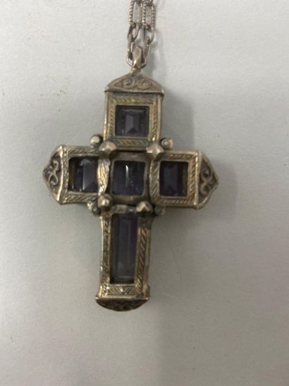 null Openwork reliquary cross and a silver chain engraved with scrolls surrounding...
