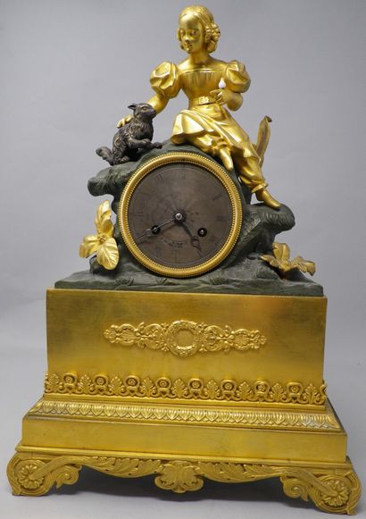 Romantic clock in gilt bronze and dark patina...