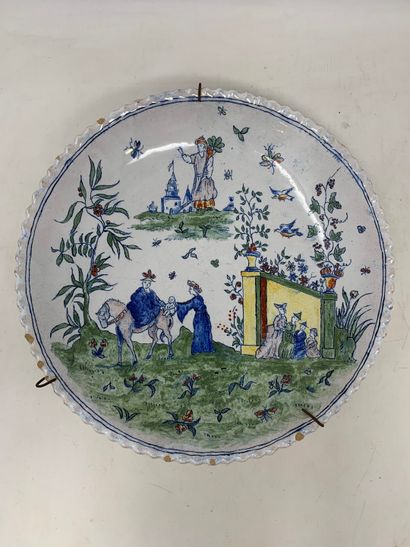 null Set of two plates in faience. One is decorated with a child and a ram. The other...