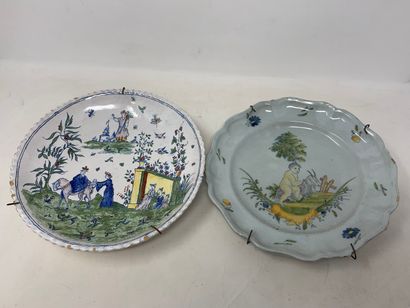 null Set of two plates in faience. One is decorated with a child and a ram. The other...