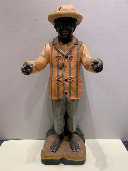 null Sculpture en résine figurant un homme de couleur en chapeau melon et veste rayée

manques...